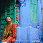Serene woman exploring Jodhpur city during her trip to India
